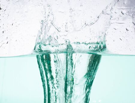 green water wave with bubblesの写真素材