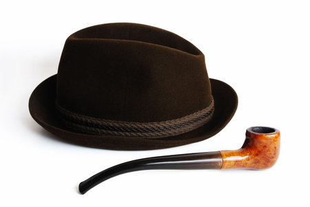 Hat and pipe on a white background