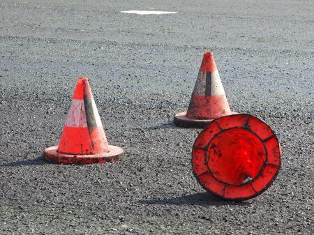 Three red traffic cone on the new asphalt.の写真素材