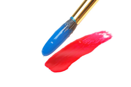 Painting on paper with blue brush.