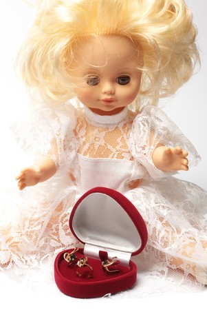 Blonde doll with a jewelery gift.の写真素材