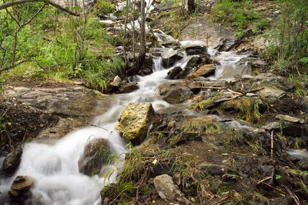 Cascades of the mountain river in the forest.の写真素材