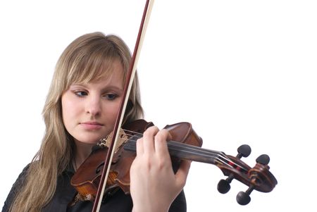 Beautiful young female violinist playing violin over white backgroundの写真素材