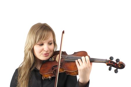 Beautiful young female violinist playing violin over white backgroundの写真素材