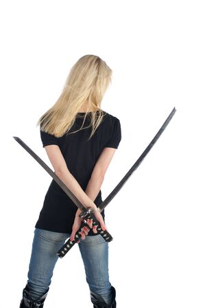 Back view of young woman with a two swords, isolated on the white backgroundの写真素材