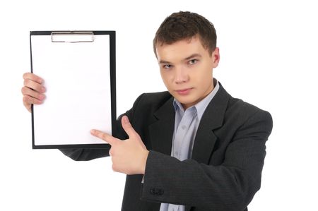 Young man point to white paper sheet, isolated on the white background.の写真素材