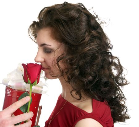 Attractive young woman get a gift with red rose isolated on the white backgroundの写真素材