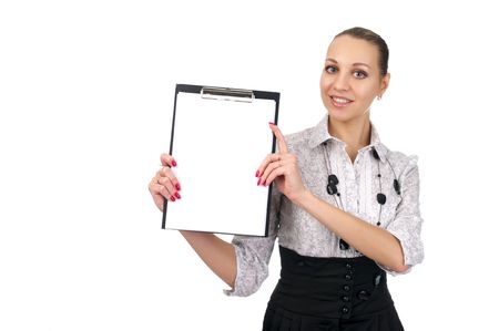 The beautiful young woman shows a blank clipboard over white background.の写真素材