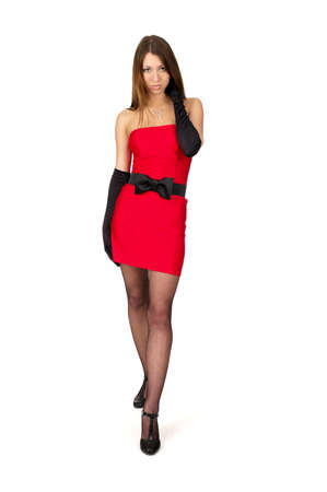 Attractive sexy female in little red dress over white backgroundの写真素材