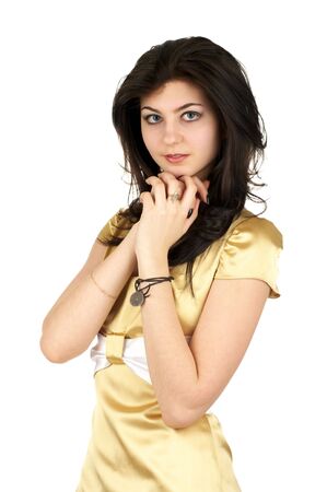 Beautiful young woman in little yellow silk dress isolated over white backgroundの写真素材