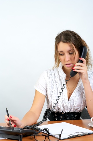 Young business woman talking phoneの写真素材