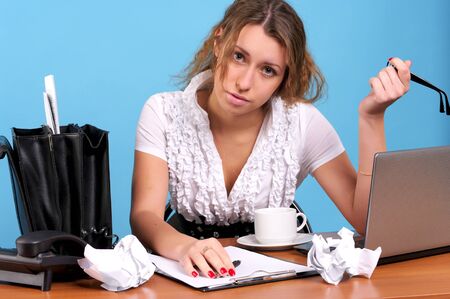 Overworked businesswoman in the office workplaceの写真素材