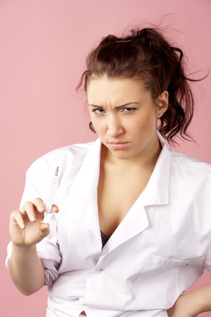 Young female doctor holding syringeの写真素材