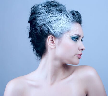 Closeup portrait of beautiful woman with winter style makeupの写真素材