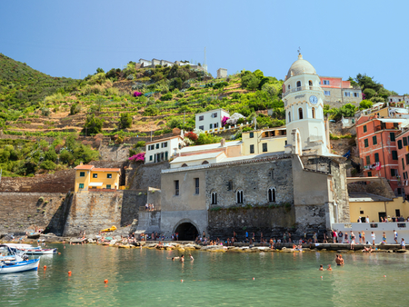The little harbour of Vernazza in the Cinque Terre is full of tourist walking along the dockのeditorial素材