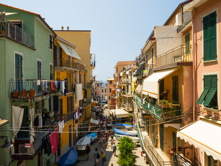 Small street of beautiful Riomaggiore village in the Cinque Terre is full of touristsのeditorial素材