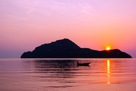 Amazing sunrise over small islandの写真素材