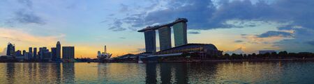 Panoramic view of Marina bay harbor with famous Marina Bay Sands hotel at sunset time, Singapore.のeditorial素材