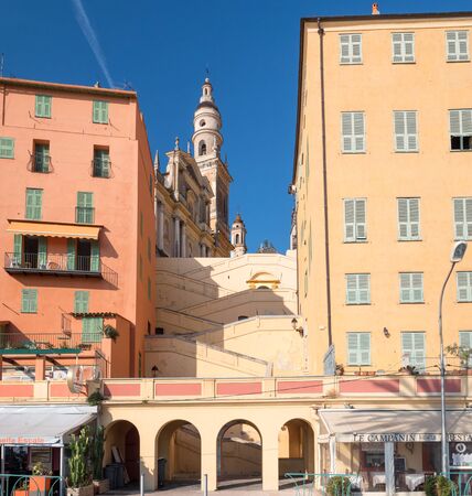 Old houses and the baroque basilica on the hill of Saint-Michel-Archange in Menton, Franceのeditorial素材