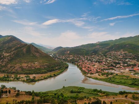Aerial view of Kura and Aragvi rivers confluence near the old Georgian town Mtskheta.の写真素材