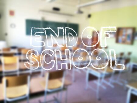 A chalk lettering with a blurred classroom in the backgroundの写真素材