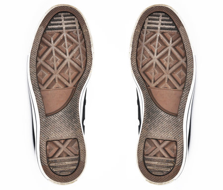 Two shoe soles on a white background