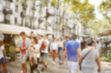 Bokeh of people crowd on a busy streetの写真素材