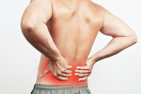 Man having a backache isolated on whiteの写真素材