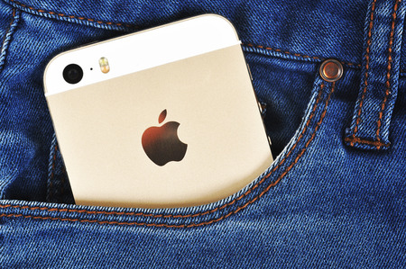 CHLUMCANY, CZECH REPUBLIC, MARCH 10, 2015: Apple iPhone 5s in a denim pocketのeditorial素材