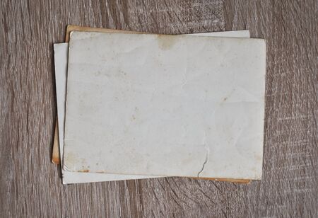 Photographs on a wooden tableの写真素材