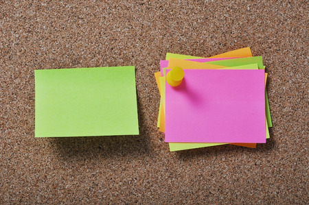 Blank papers hanging on a cork boardの写真素材