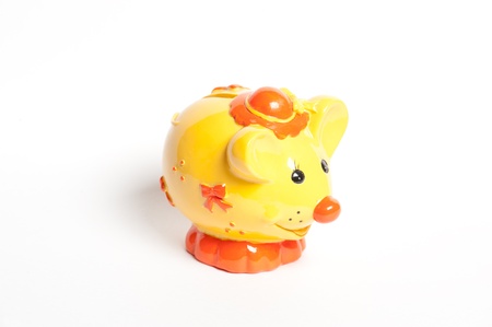 Yellow moneybox pig on white backgroundの写真素材
