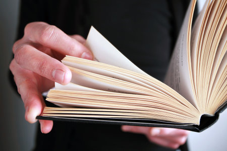 close up pic of person reading a book