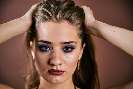 Beauty young woman face portrait. Model girl with perfect fresh clean skin. High fashion model woman in studio, portrait of beautiful sexy woman with trendy make-up and manicure. Skin care concept.の写真素材