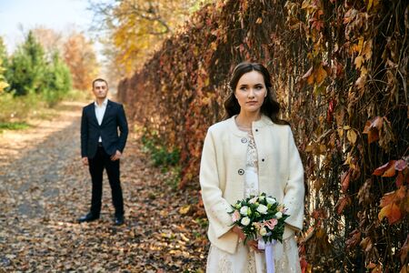 Couple in love close-up portrait. Young male and woman just married. Concept of happy family. Modern family outdoor. Adorable family demonstrate love and care. Autumn vacation.の写真素材