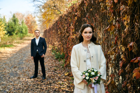Couple in love close-up portrait. Young male and woman just married. Concept of happy family. Modern family outdoor. Adorable family demonstrate love and care. Autumn vacation.の写真素材