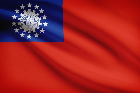 Burmese flag blowing in the wind. Part of a series.の写真素材