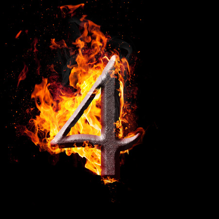 Hot metal burning numbers on black background - number fourの写真素材