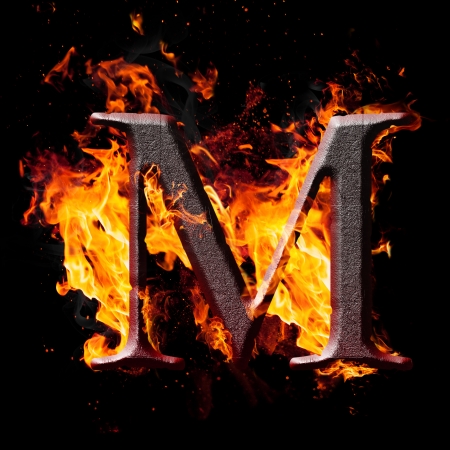 Letters and symbols in fire - Letter M.の写真素材