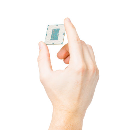 Male hand holding computer's processor - on a white 
