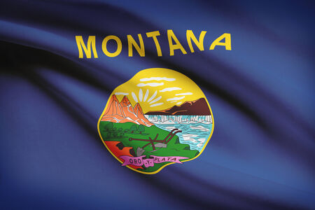 State of Montana flag blowing in the wind. Part of a series.の写真素材
