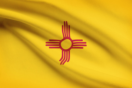 State of New Mexico flag blowing in the wind. Part of a series.の写真素材