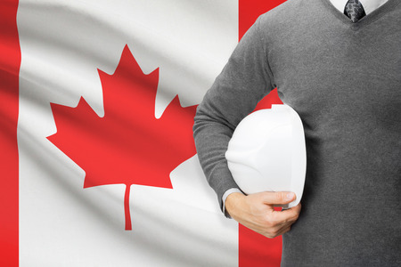 Architect with flag on background  - Canadaの写真素材