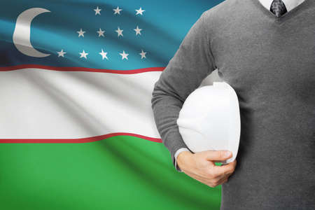 Architect with flag on background  - Uzbekistanの写真素材
