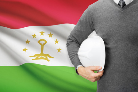 Architect with flag on background  - Tajikistanの写真素材