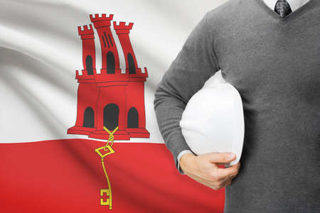 Engineer with flag on background - Gibraltarの写真素材