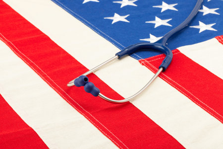 Blue stethoscope over US flag - studio shootの写真素材