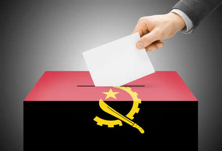 Voting concept - Ballot box painted into Angola national flagの写真素材