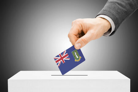 Voting concept - Male inserting flag into ballot box - British Virgin Islandsの写真素材
