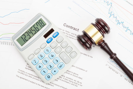 Judge's gavel and calculator over contract